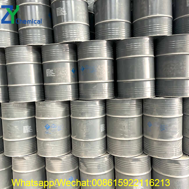 A close-up view of sealed grey chemical drums containing premium calcium carbide, clearly labeled and ready for global shipping.