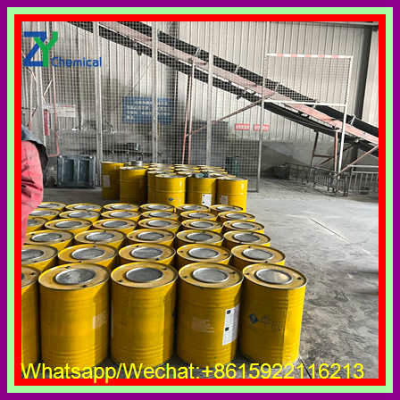 Professional calcium carbide manufacturers in china utilize fully integrated conveyor systems and robust yellow packaging drums to streamline industrial logistics and distribution.
