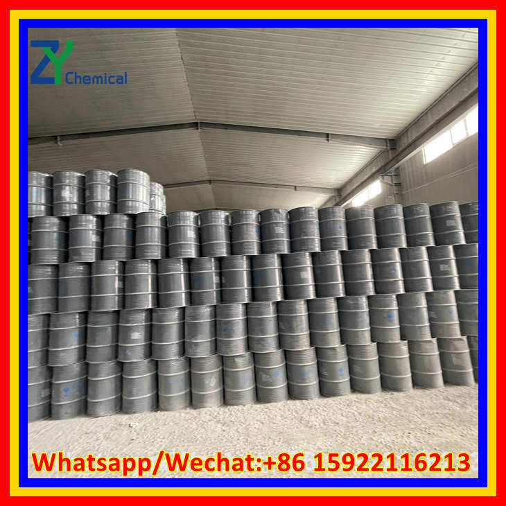 High-purity calcium carbide stone stored in heavy-duty steel drums in a well-ventilated factory warehouse.