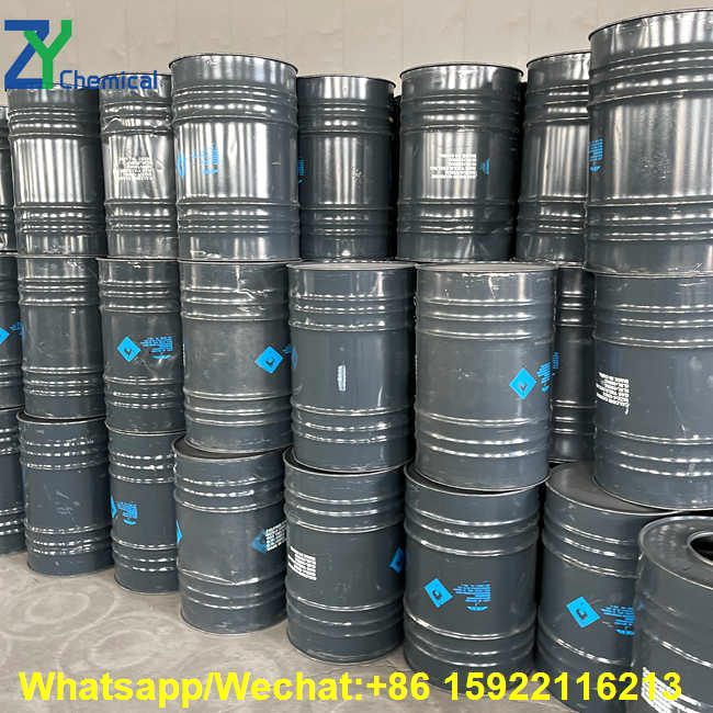 Stacked dark grey drums in facility storage ensuring stable supply and affordable cac2 price per metric ton.